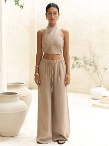 Close-up of linen halter top and drawstring wide-leg pants set in oat beige color
