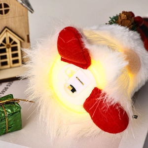 Detail of the bottom battery compartment and power switch for glowing gnome decor