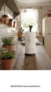 Detail of vintage cast iron rooster paper towel holder on a rustic kitchen wooden countertop
