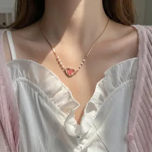 Bracciale estivo dorato con cuore a pesca, gemma rosa e perle d'imitazione da donna