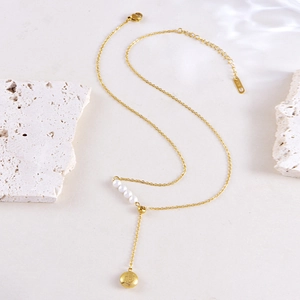 Elegant gold butterfly tassel necklace with white pearls and lucky Fu pendant charm