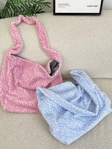 Pink and blue leopard print plush tote bags with checked lining and soft texture