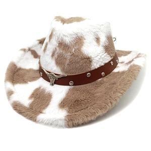 Close-up of western cowboy hat with cow print pattern and leather band with bull head stud