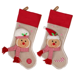 Christmas gingerbread man stockings in burlap and red fabric for holiday tree decoration