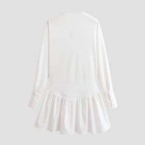 Elegant white batwing sleeve dress with buttoned cuffs and ruffled hemline