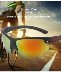 Detail of matte black cycling sunglasses featuring orange gradient lenses and red accents