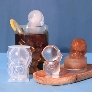 Close-up of flexible 3D astronaut silicone mold with finished ice cubes for drinks