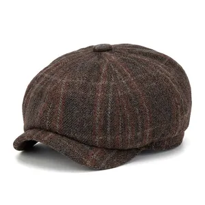 Brown plaid wool newsboy cap for men featuring a wide brim and warm checkered pattern