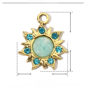 Macro view of gold sun pendant with blue natural stone and size parameter markings