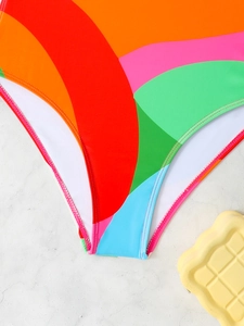 Detail of colorful geometric wavy pattern stitching on high-stretch one-piece swimwear