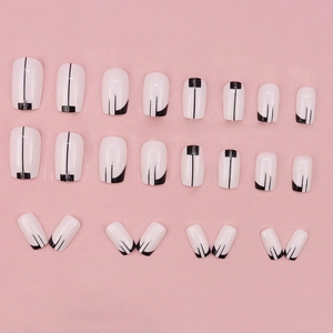 24pcs black and white geometric press-on nails with silver glitter accents on pink background