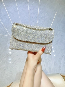 Detailed view of shimmering silver rhinestones on an elegant luxury evening clutch bag