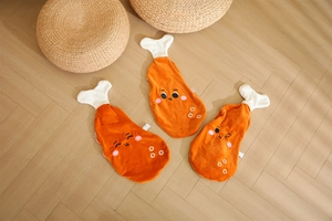 Detailed embroidery of cute facial expressions on chicken leg plush pillow covers