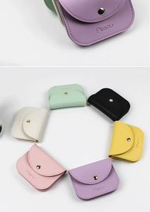 Detailed macro view and color assortment of PU leather mini coin purses with snap closure