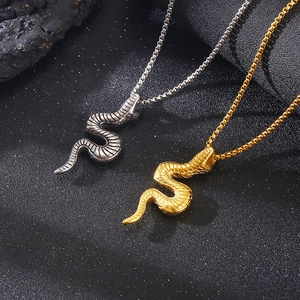 Close-up of 3D snake pendants with realistic scale textures in gold and silver steel