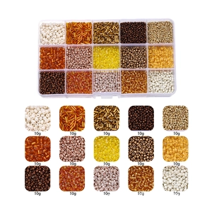 Macro detail of 15 compartments with assorted glass seed beads and bugle beads for DIY