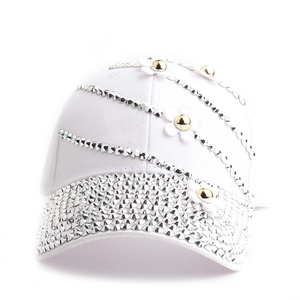 Detail of white cotton baseball cap with silver rhinestones and 3D flower appliqués