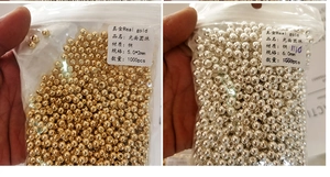 Detail of 18K gold-plated copper beads for jewelry making in bulk 1000pcs packaging