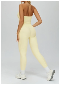 Rear view of light yellow high-waisted yoga leggings and backless top set for workout
