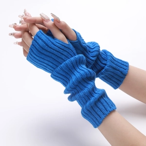 Close-up of blue knitted fingerless arm warmers with ribbed texture for winter comfort