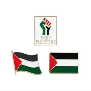 Detail of metal Palestine flags and Free Palestine badges with colorful enamel finish