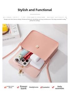 Top view of pink crossbody bag with pearl charm showing interior storage for phone and makeup