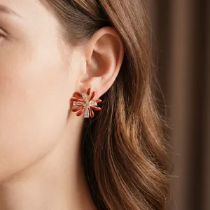 Exquisite flower stud earrings with zircon inlay and red enamel on a gold-plated base