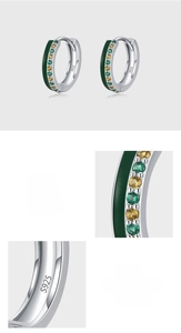 Macro detail of S925 sterling silver stamp and hand-paved green enamel cubic zirconia earrings