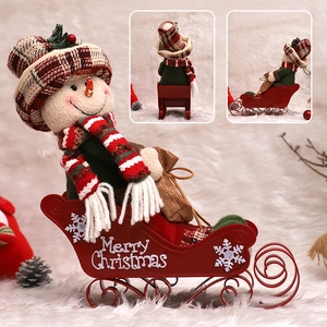 Christmas snowman on red metal sleigh decoration with Merry Christmas text print