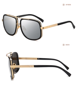 Detail view of black and gold pilot sunglasses showing metal frame and side temple design