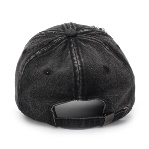 Close-up of distressed washed denim baseball cap featuring metal buckle and worn edges