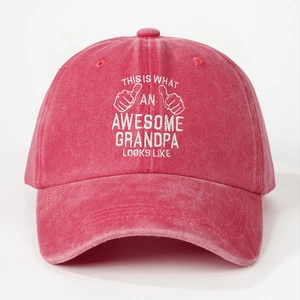 Detail of embroidered 'AWESOME GRANDPA' text on a distressed red washed cotton baseball cap