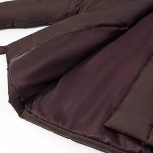Detail of windproof fabric and silk lining on deep coffee padded cotton jacket