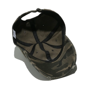 Inside view of camouflage baseball cap with distressed brim and cotton stitching