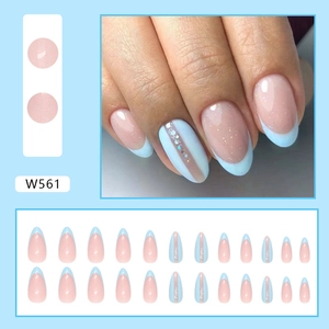 French style almond false nails with light blue tips and silver glitter accents