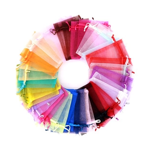 Macro shot of colorful organza drawstring bags for jewelry packaging in multiple colors