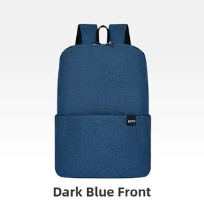 Front view of a minimalist deep blue backpack showing durable texture and handle