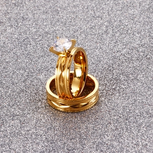 Detailed macro view of a gold-plated titanium steel ring set with a large cubic zirconia stone