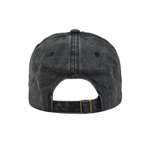 Detail of washed cotton baseball cap featuring vintage texture and adjustable metal buckle