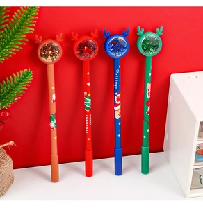 Macro detail of Christmas pens with reindeer sequins, liquid glitter globes and festive patterns