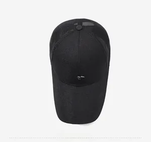 Close-up of black breathable mesh panel and sport logo on a summer baseball cap