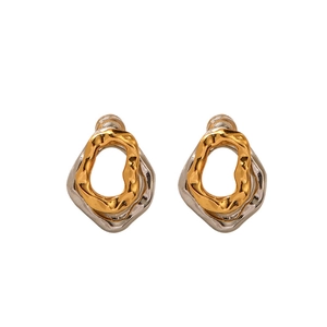 Modern lava texture earrings in silver and gold two-tone finish with geometric design
