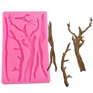 Detail showing branch-shaped silicone mold with realistic chocolate tree bark examples