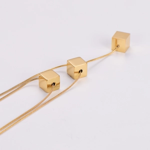 Minimalist double-layered gold snake chain necklace with three polished cube pendants
