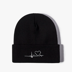 Unisex black knitted beanie featuring white heart rate embroidery on folded cuff