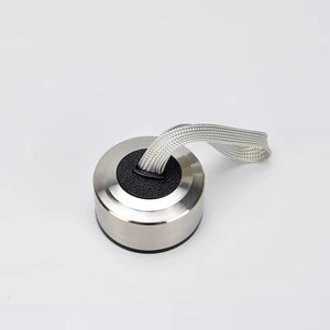 Close-up of stainless steel water bottle lid with a gray braided carrying strap