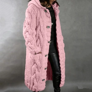 Close-up of pink cable knit cardigan featuring a cozy hood and large round buttons