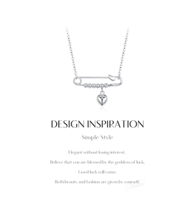 Macro view of S925 sterling silver paperclip chain with mirror heart pendant detail