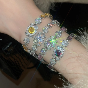 Detailed macro view of sparkling zircon flower bracelets in yellow pink white and purple