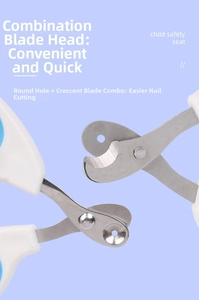 Detail view of cat nail clippers featuring round hole and crescent stainless steel blades